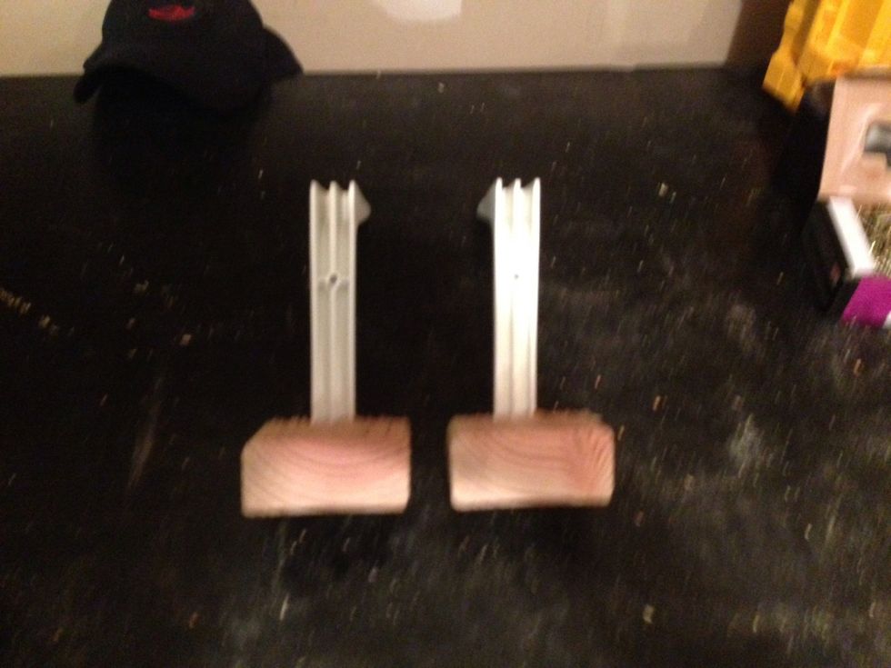 (Crap photo sorry) both pieces screwed to the shelving brackets.