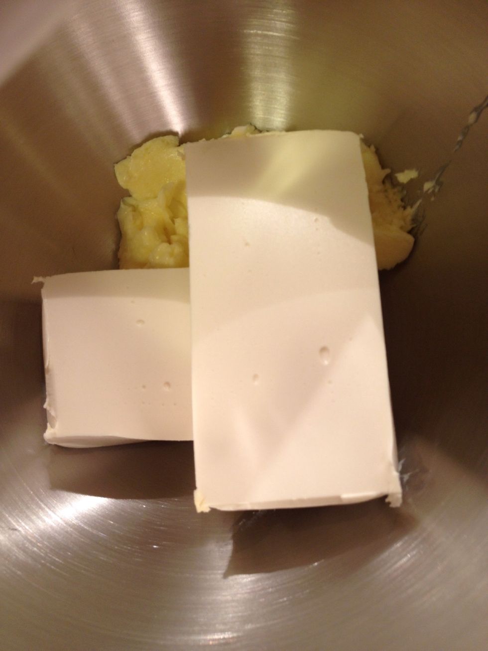Cream butter and cream cheese together in stand mixer until smooth.