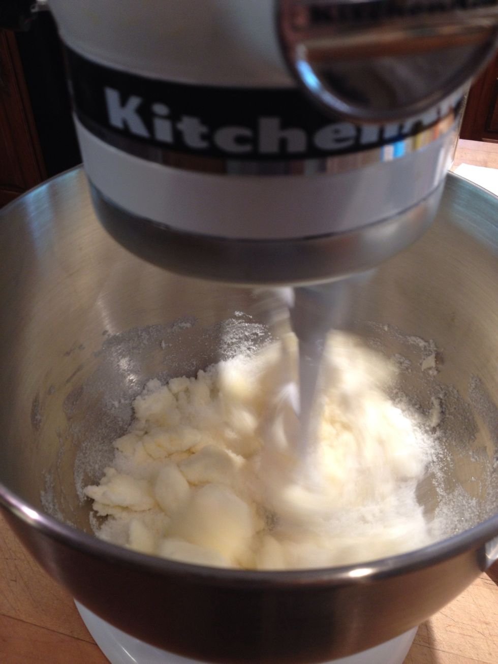 Cream sugar and butter in a mixing bowl.