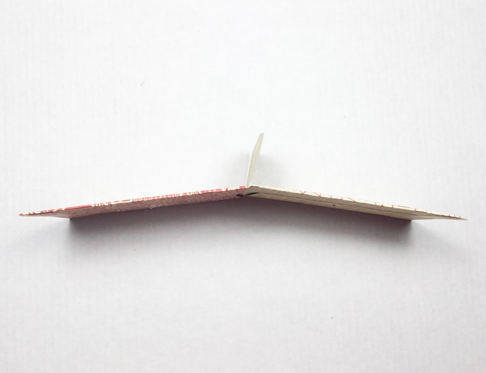 Cream tab is showing this is the glued and inserted into the next envelope.