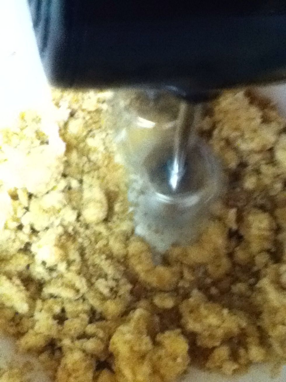 Cream together butter and sugars with an electric mixer.