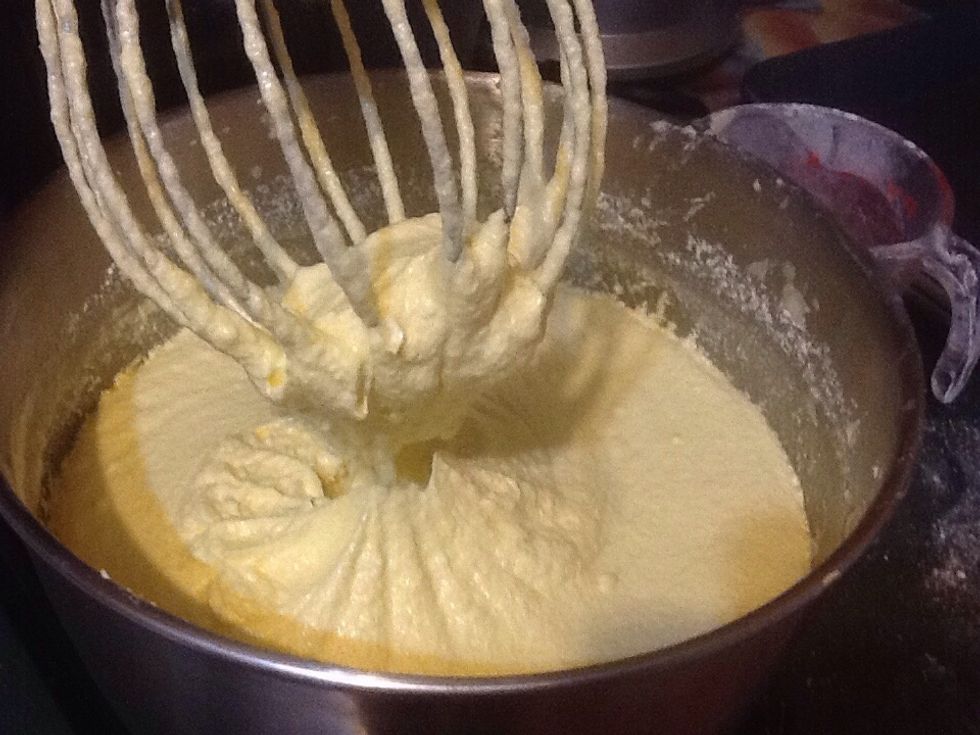 Cream together butter, shortening, sugar,eggs yolks, almond flavour.brandy, milk,creamed mixture alternately with liquid  ,make 2dry and 2liquid additions combine lightly after each ,beat eggs whites