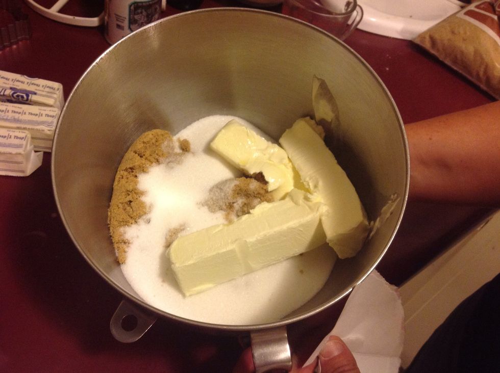 Cream together butter, white sugar, and brown sugar