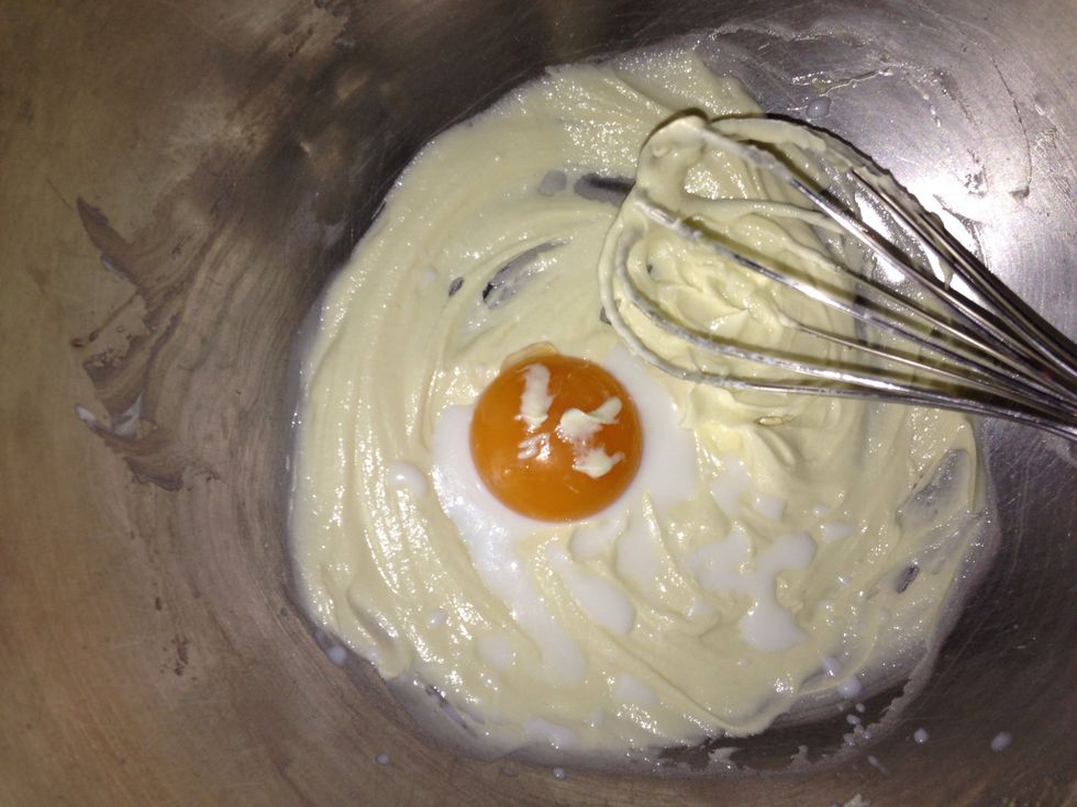 Cream together egg yolk and milk also.