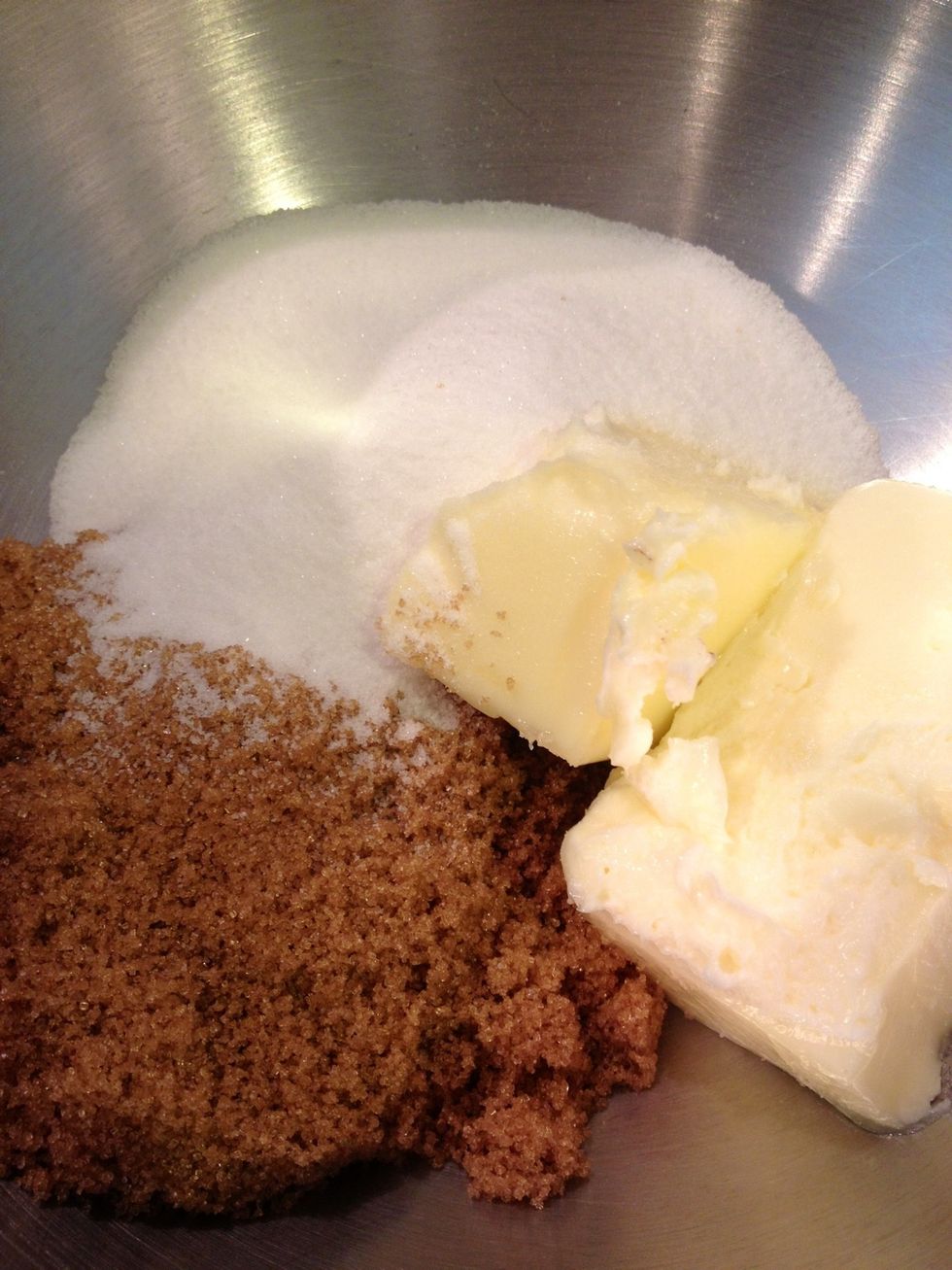 Cream together the butter and sugars on high speed until fluffy.