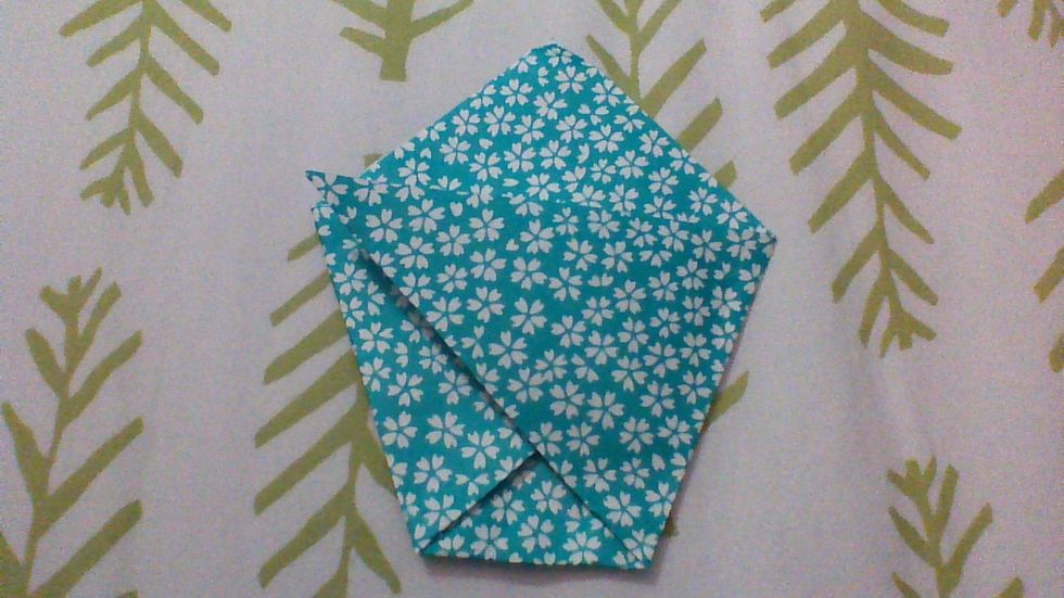 crease both of the folds you just made securely. If the corner sticks up, that's fine it'll go away once you do the next step.