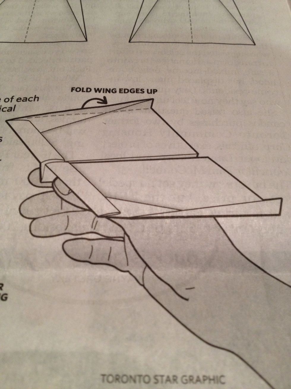 Crease the edge of each wing to add vertical stabilizers. If you've folded it properly the wing should curve up slightly, giving your plane lift.
