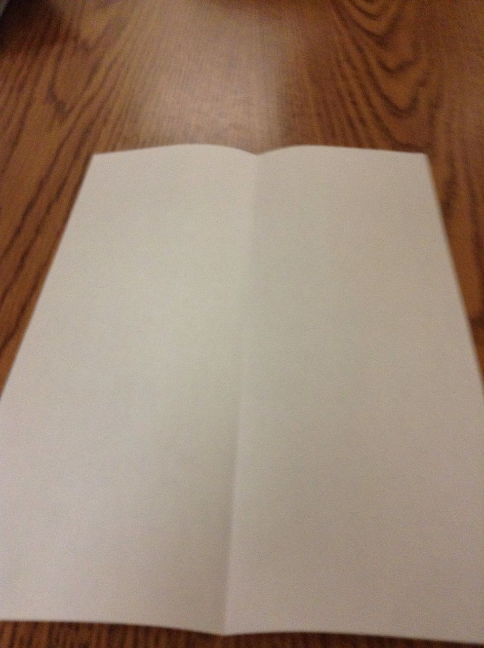 Crease the paper down the centre hot-dog way.
