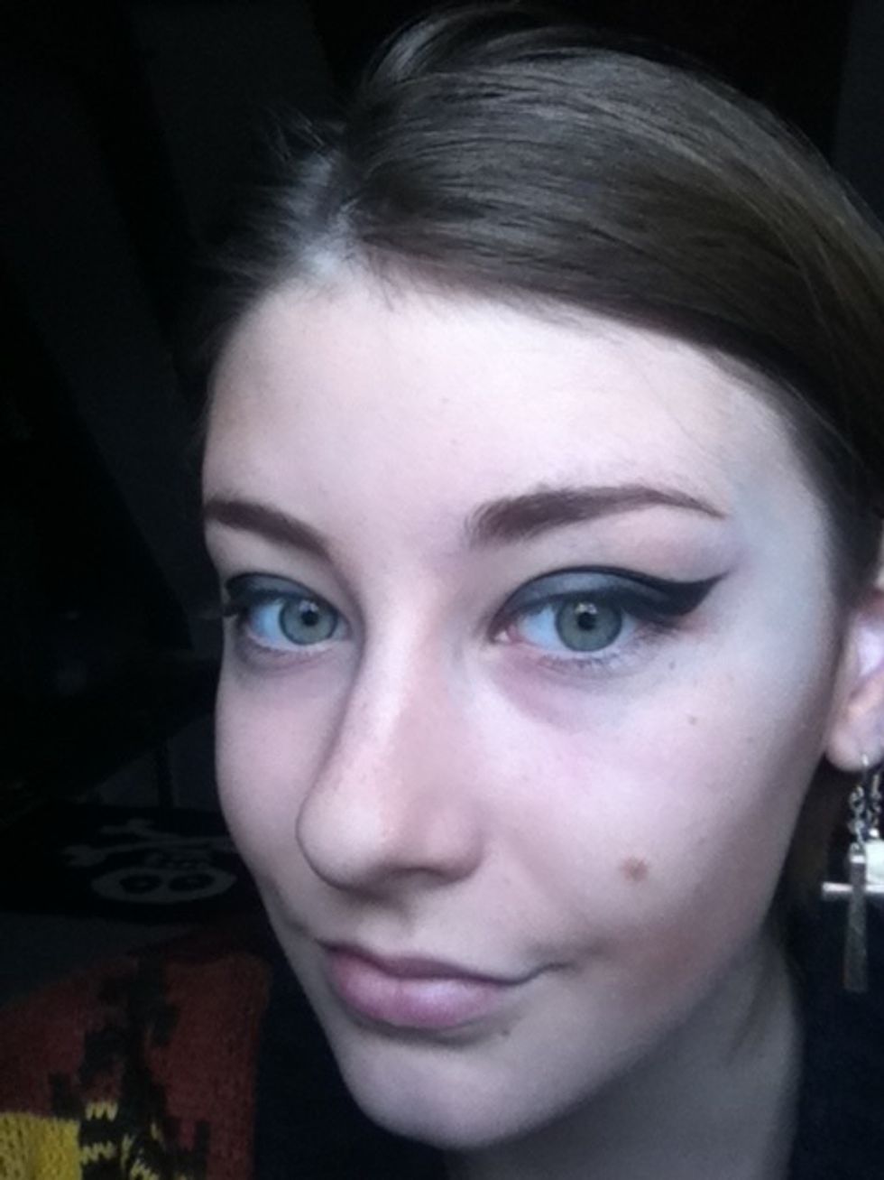 Creat a smokey flick, use an angles eyeliner brush to straigten and neaten it up abit.