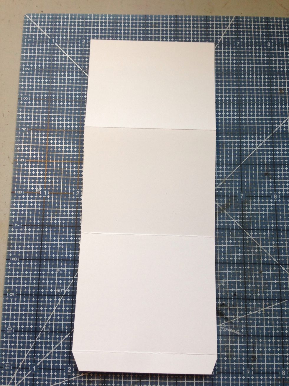 Creat smaller pockets for the first, third, fourth, and sixth fins by cutting a 4" x 10" rectangle from card stock. Score and fold at 1/2", 3 3/4", and 7" from one end. Notch corners of 1/2" tab.