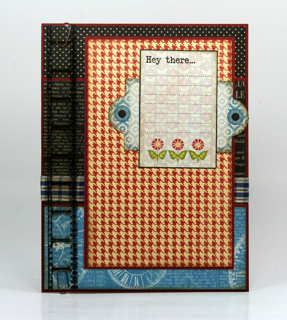 Create a border with Tim Holtz Film and metal clips.