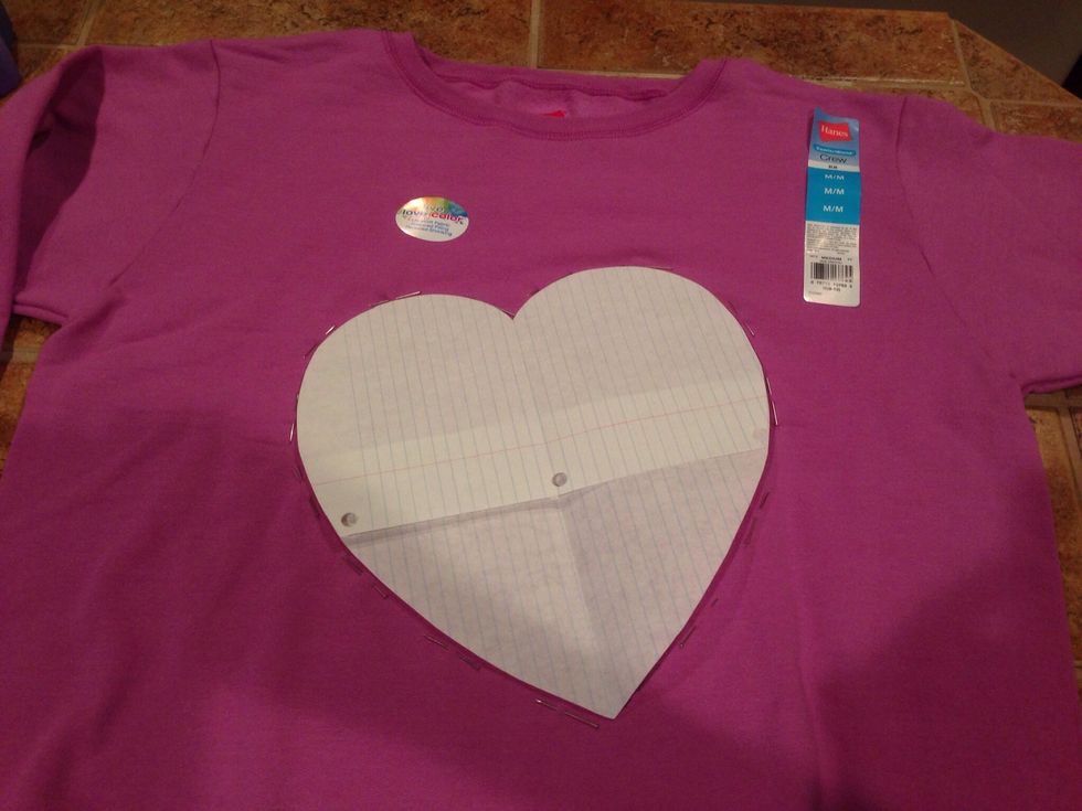 Create a cutout heart. Lay it on the shirt and place pins around it to trace your pattern. Pin only through the first layer. This will help keep you from cutting through the underlayer.
