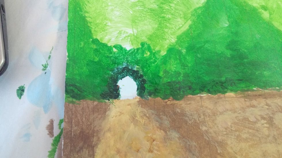 Create a deeper green. dab this around the opening of the trees. This gives the illusion this is further away as its gets darker. do this to both openings