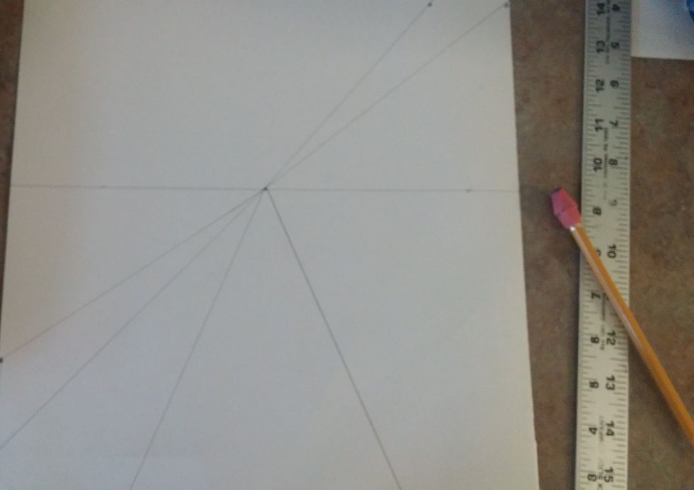 Create a dot 2 inches from the top dot (or at 12 inches) Connect each dot to the vanishing point. Do the same in the bottom portion 2 inches from the dot (at 11 inches.) and connect this to the point.