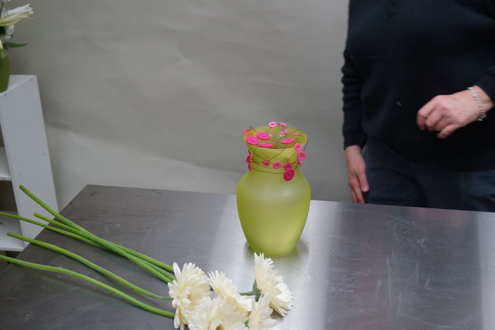 Create a grid and twist over the buttons to secure.