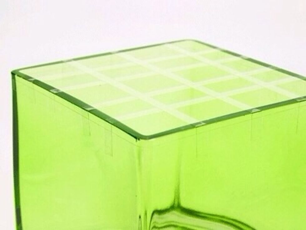 Create a grid using 3-4 strips from side to side, like a tic-tac-toe board. To ensure the strips stay in place wrap a final long strip all the way around the top of the cube.