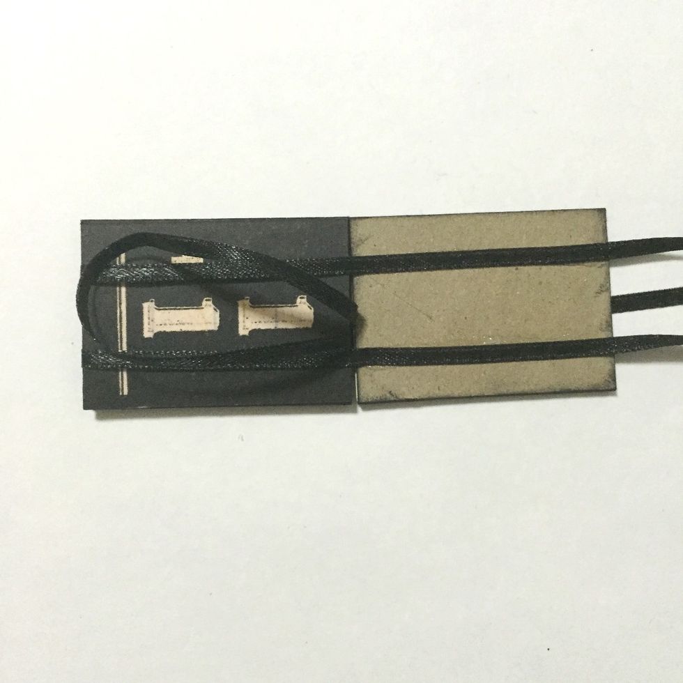 Create a loop by inserting the center ribbon onto the gap between the 1st and 3rd number blocks as shown...