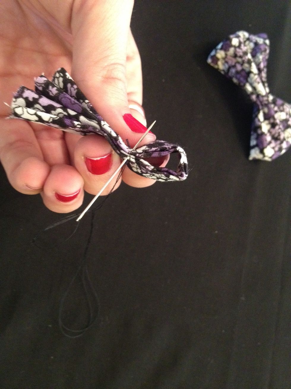 Create a loop with this strip and sew a straight line to hold it in place. Make sure the loop is loose enough for the bow to fit through, but tight enough to appear as a knot.