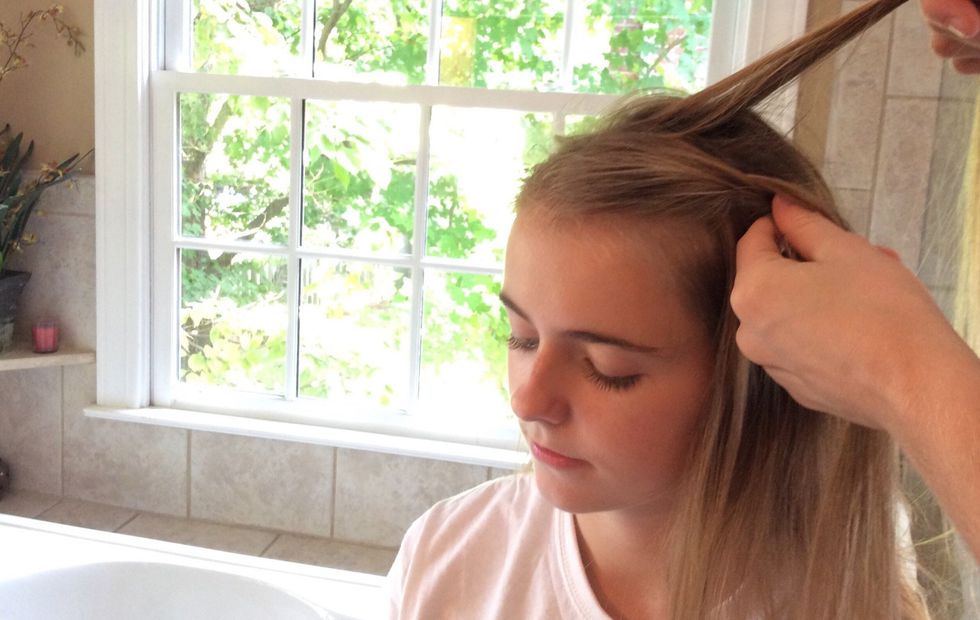 Create a new section of hair towards the top of your head in place of the front piece you just let go.