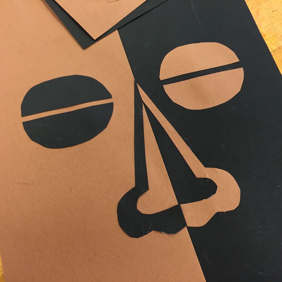 Create a nose by folding and cutting paper.