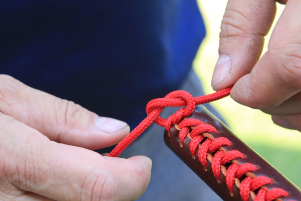 Create a reef (square) knot by tying a second overhand knot as in figure 16.