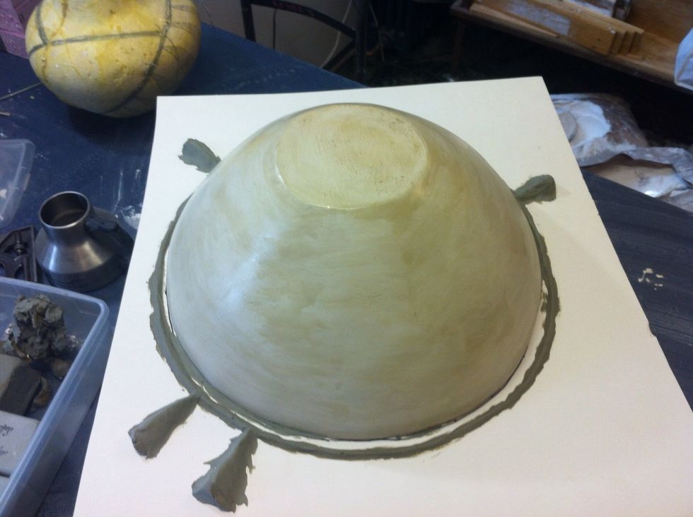 Create a ridge all the way around your parting line to key the two pieces of latex together. Use additional keys to orient the Pates together and for keying the plaster mother molds together.