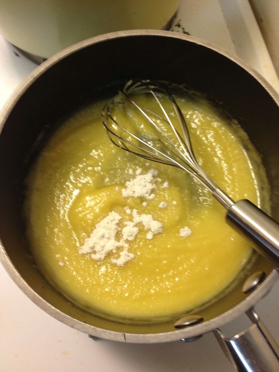 Create a roux by wisking in 1/4 cup of flour until thick. Then add onions.
