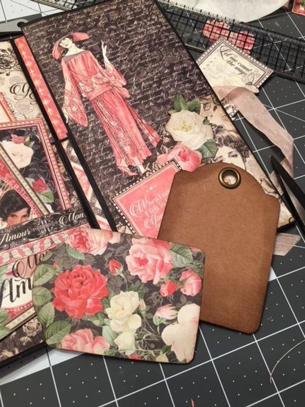 Create a tag for the angled pocket. Use a Graphic 45 tag and mat with Dearest Darling Rose paper.