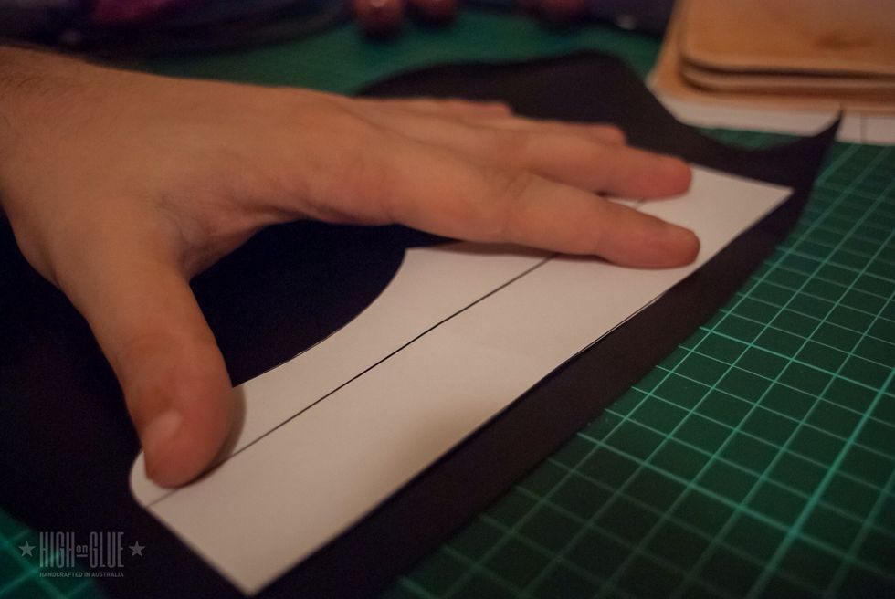 Create a template for the spine of the cover and use it to cut a thin but strong piece of leather. I use kangaroo leather because it is very strong and still flexible.