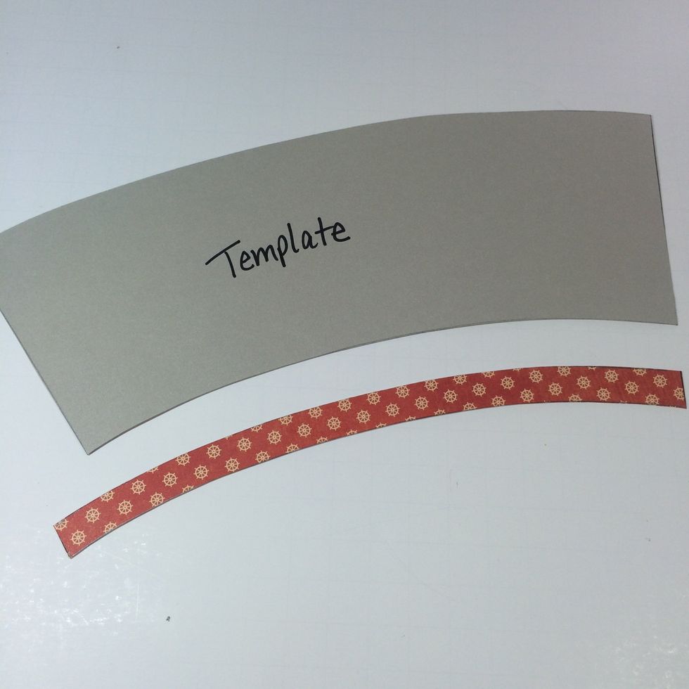 Create an accent strip by tracing the lower portion of your template onto a coordinating pattern paper. Use the traced line as a guide to cut your strip about 1/2 inch wide.