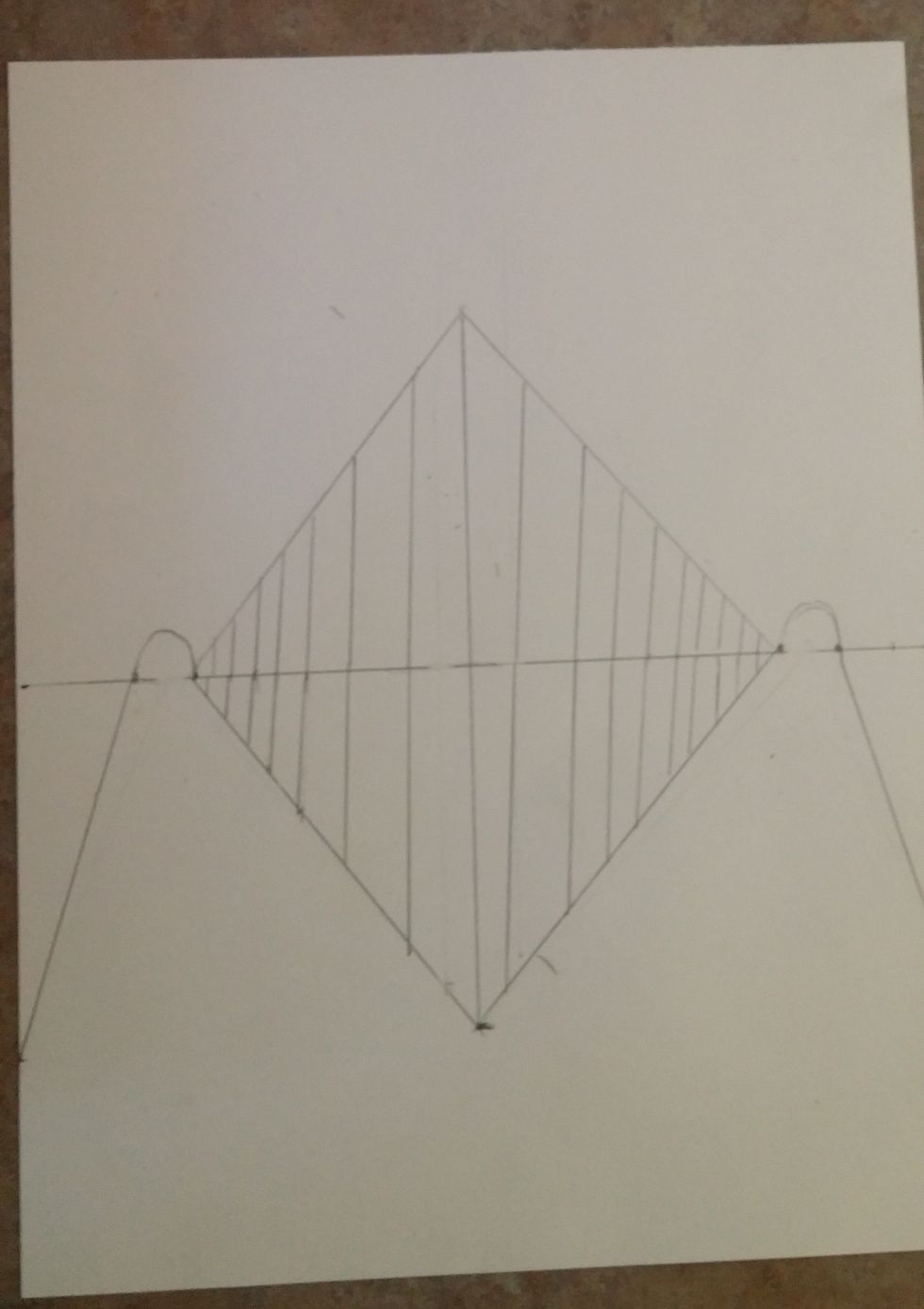 Create straight vertical lines in this diamond. Leave more space between the front few trees and as they go back to the vanishing point make them closer together and shorter.