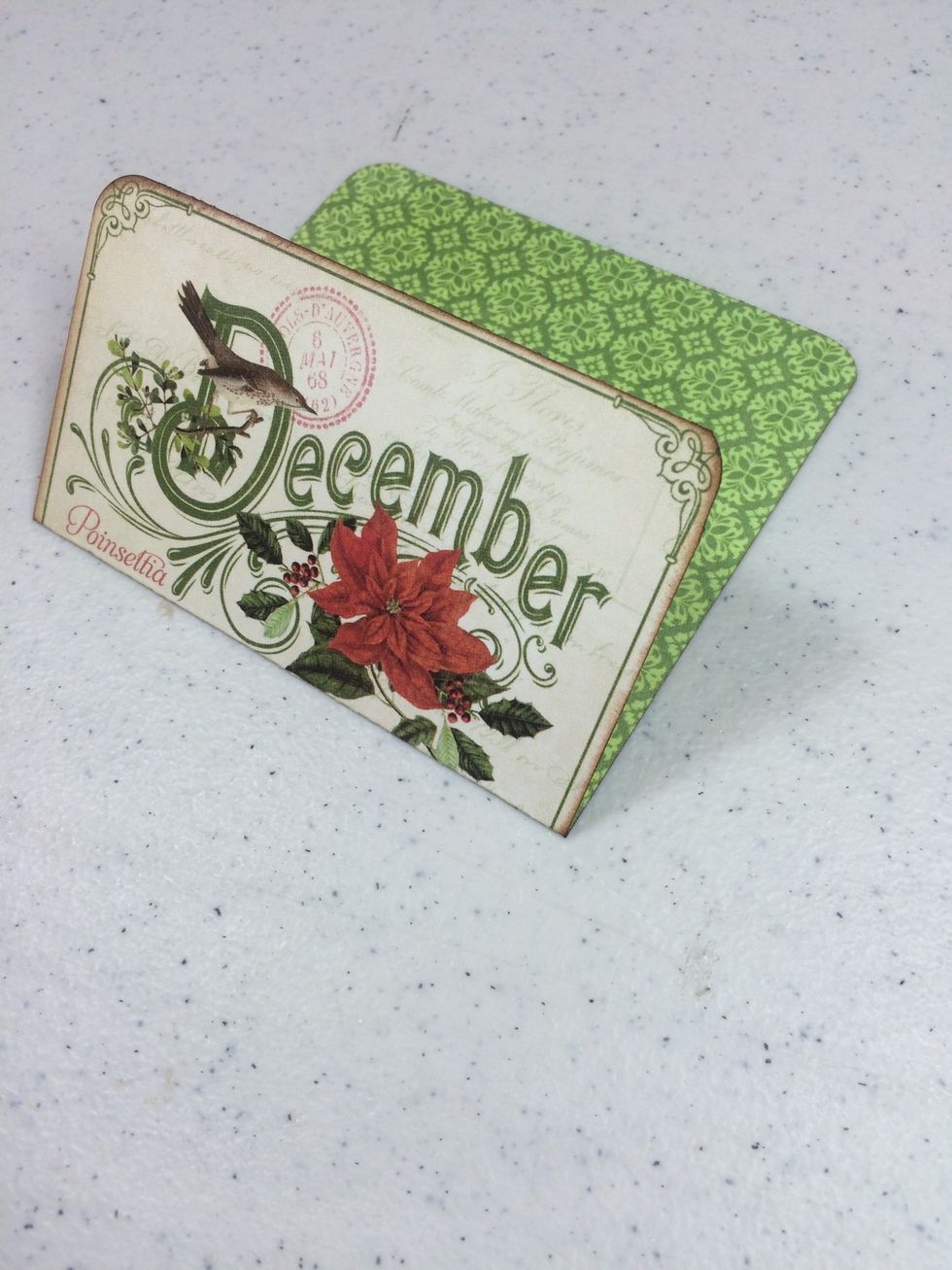 Create the first gift card holder by rounding off the corners of the tall December cut-apart. Score at 2 1/4" from the top and fold as shown.