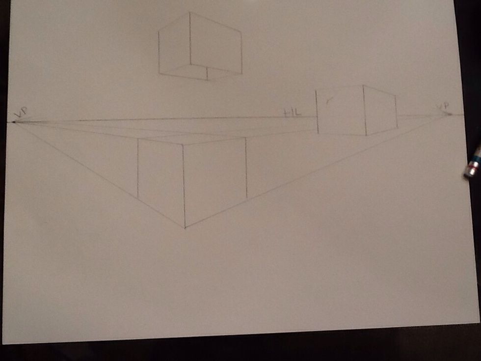 Create the top by connecting each side line to the opposite vanishing point.
