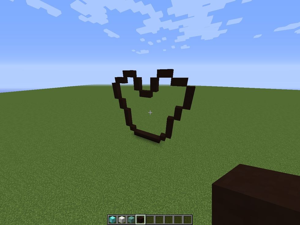 Create this frame out of black stained clay.