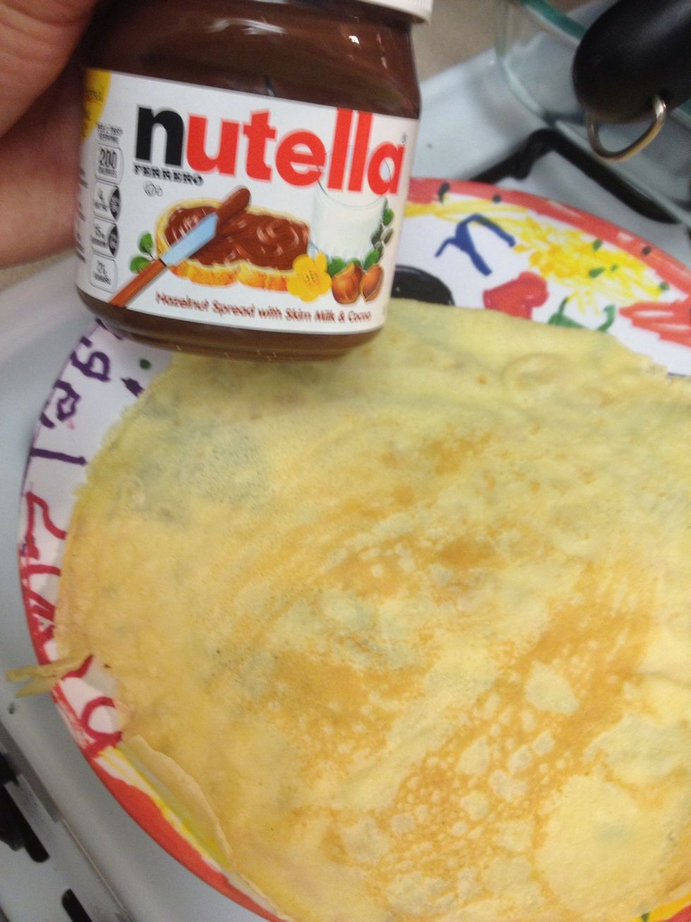 Crepe should be done, add Nutella while its warm, it'll go on smoothly