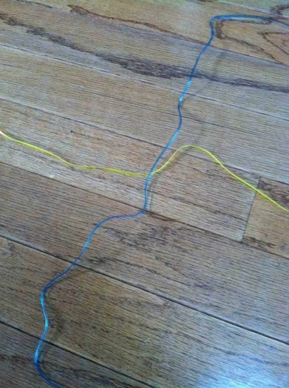 Criss-cross the lanyards.