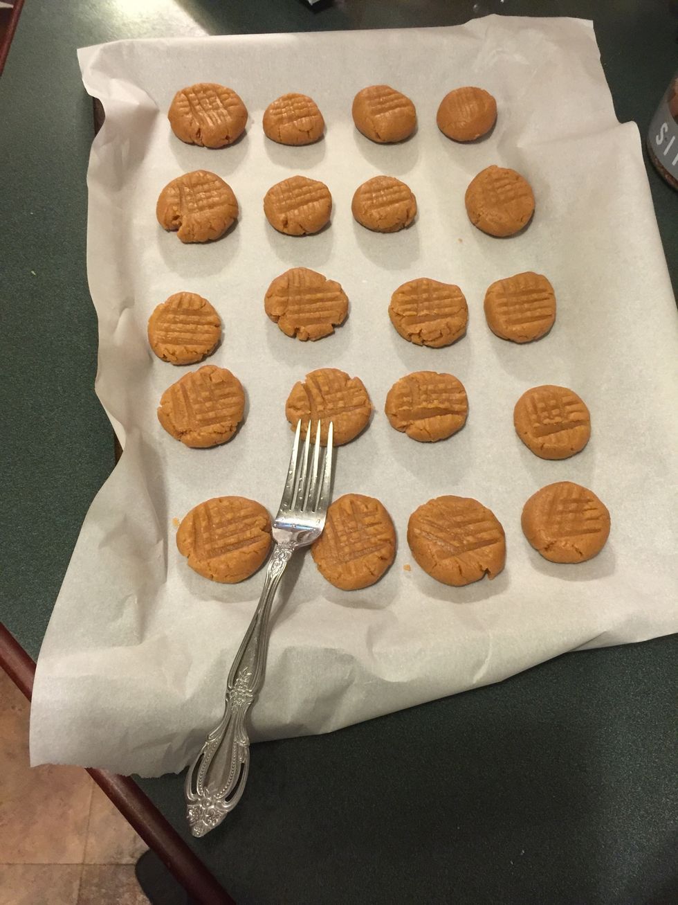 Crisscross with a fork. Put cookies in a 350\u2022 pre heated oven and bake for 10-12 minutes