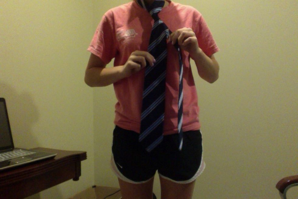 Cross in front of the tie