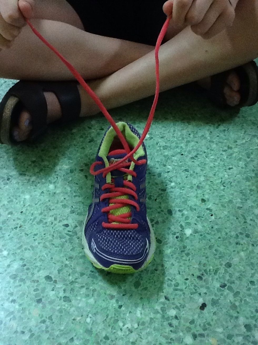 Cross the laces to make an X