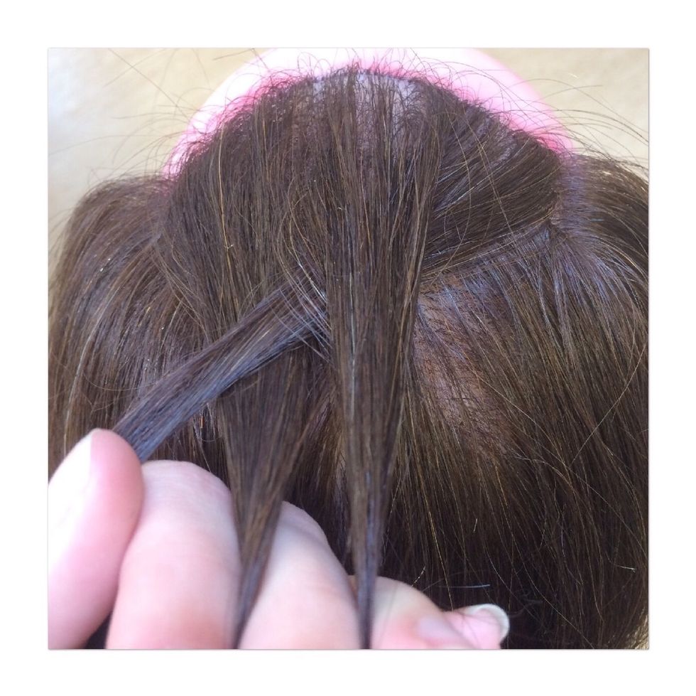 Cross the left strand under the middle strand