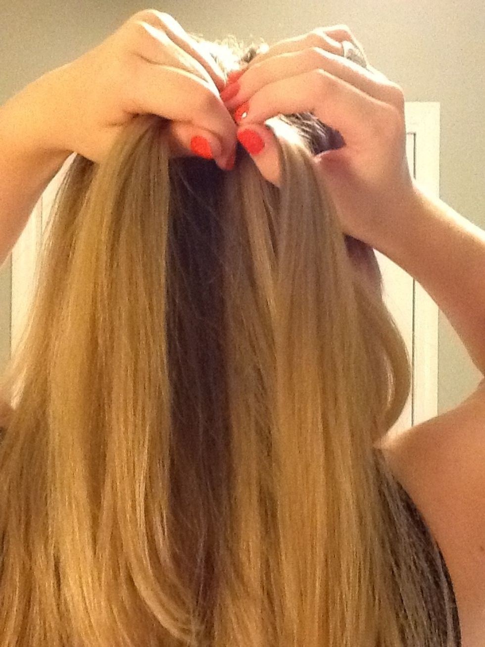 Cross the new right section over so it becomes the middle section of hair.