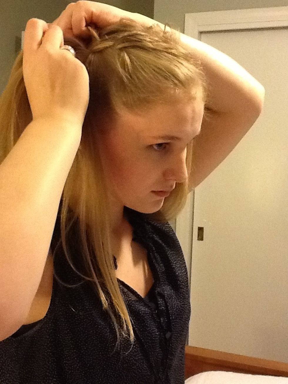 Cross the new section of hair over so it becomes the middle section.