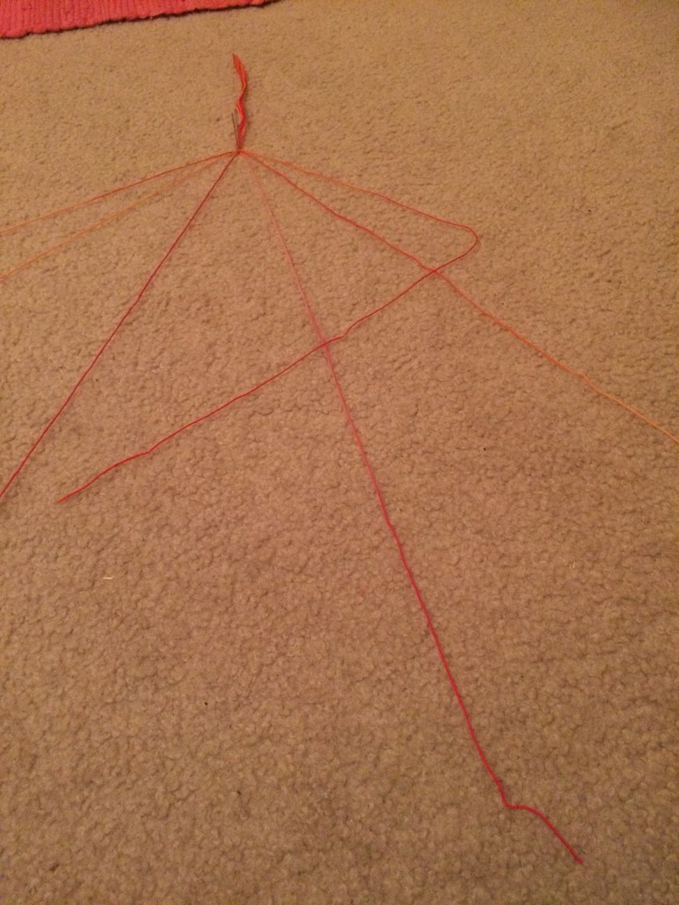 Cross the outer right most strand into a 90 degree angle over the strand next to it.