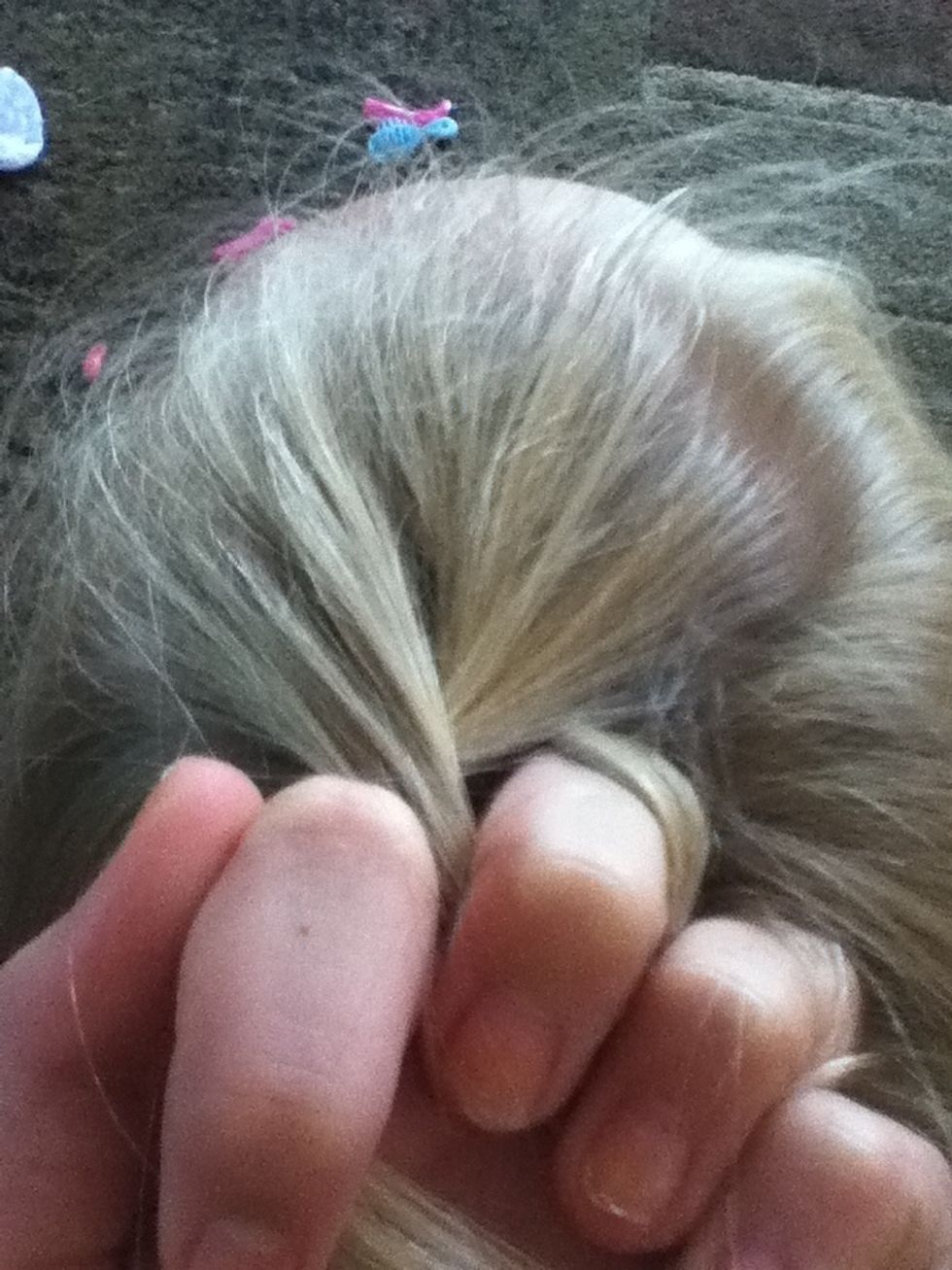 Cross the right piece over the left and then the left over the right just like a regular braid.