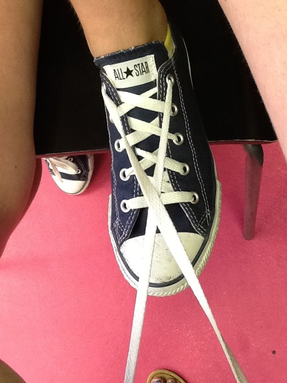 Cross the two laces to make an X.
