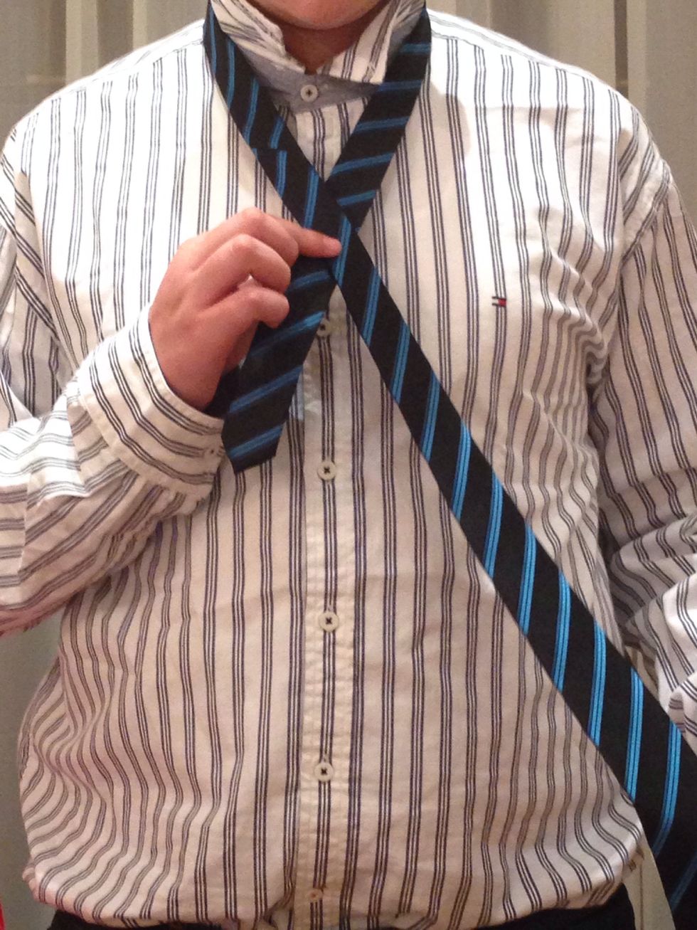 Cross the wide end over the narrow end.