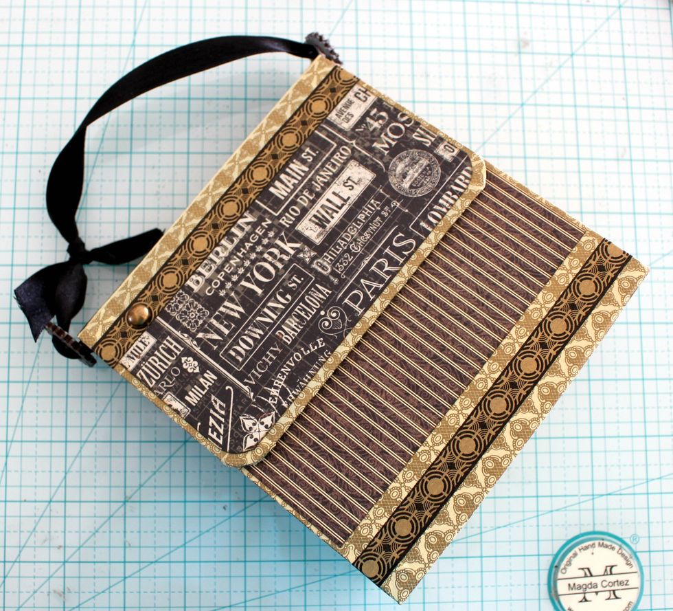 Crossroads and Global Odyssey Paper is the one I used for the front of the purse.. also on each circle of the washi tape I'm going to add one metal stud.