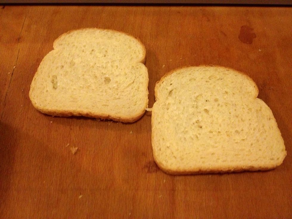 Crumble a slice of white bread.
