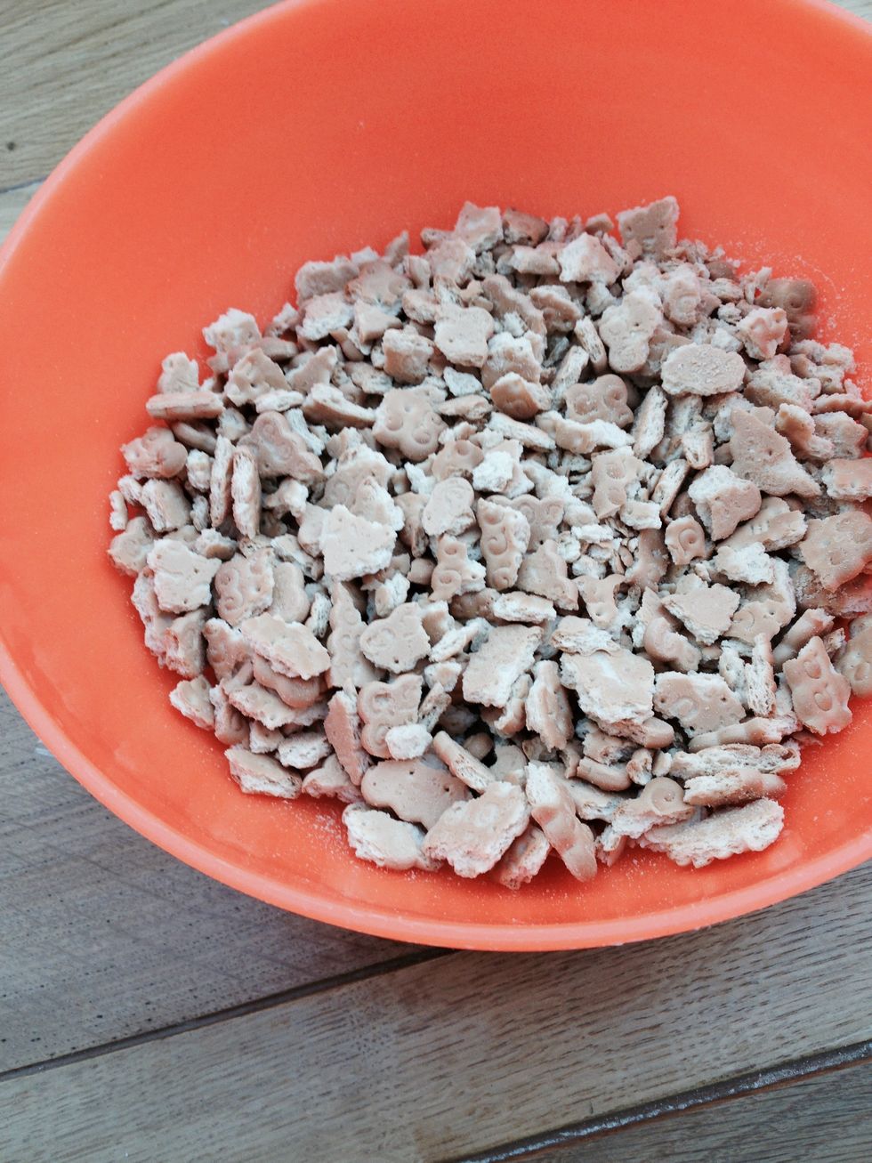 Crumble all the buiscuits in a bowl with a rolling pin