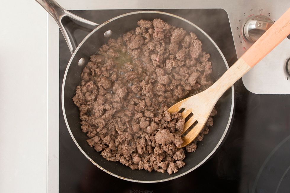 Crumble and brown your ground beef in a large pan over medium-high heat.